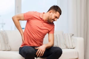 Ngồi lâu bị đau lưng là do nguyên nhân gì? Cách khắc phục?